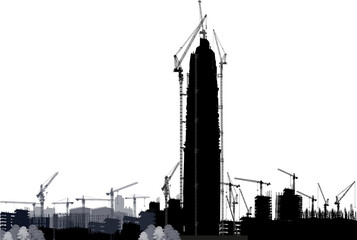 cranesand skyscraper above small buildings silhouette