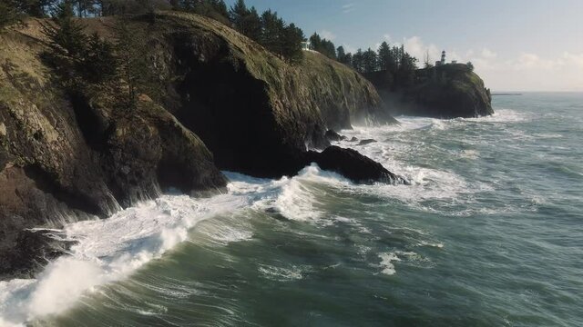 Backward Drone Flight Over King Tide Waves with Cape Disappointment Lighthouse