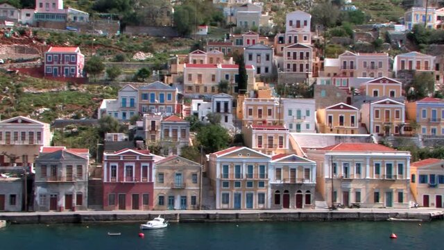 Symi Greece Rhodes is a Greek island It is mountainous and includes the harbor town of Symi and its adjacent upper town Ano Symi, with beautiful neoclassical uniform and colorful houses