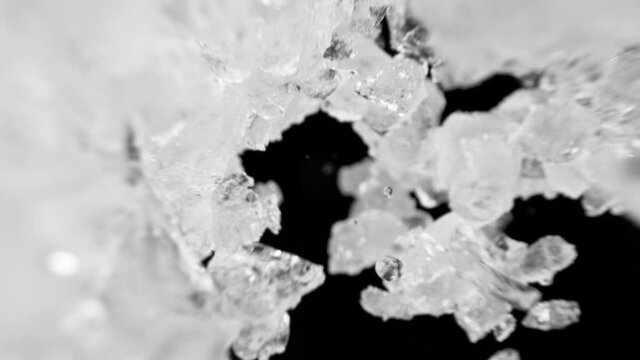 Super slow motion of falling ice cubes isolated on black background. Filmed on high speed cinema camera, 1000 fps.