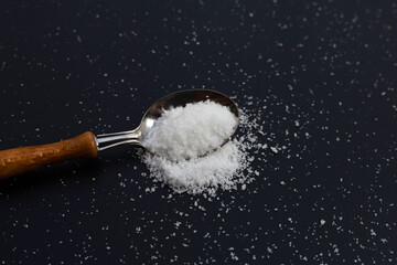 Salt on dark background. copy space