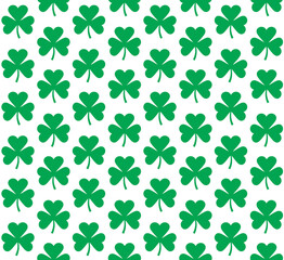 Vector seamless pattern of flat green shamrock clover isolated on white background
