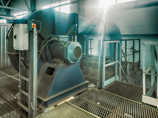 The electric motor drives the smoke exhauster in the boiler room.