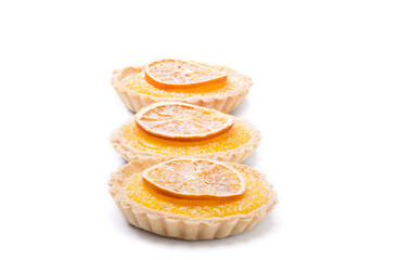 Traditional french lemon tart, top viewTraditional french lemon tart, with orange slice