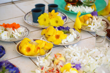 flowers in plates in a Buddhist temple Sri Lanka
