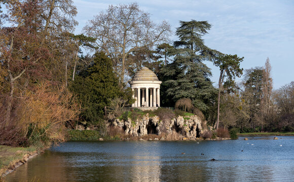 Romantic winter view of the Temple of Love and the artificial grotto on the Isle de Reuilly located on the Lac Daumesnil in the largest parisian public park "Bois de Vincennes".
