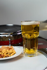 Professional drum set closeup. Man drummer with drumsticks playing drums and cymbals, on the live music rock concert or in recording studio   