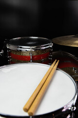 Closeup of drumsticks lying on the professional drum set. Drummer equipment. 