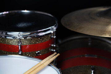 Fototapeta na wymiar Closeup of drumsticks lying on the professional drum set. Drummer equipment. 