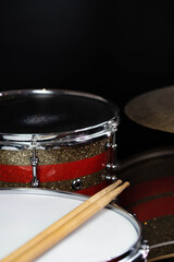 Closeup of drumsticks lying on the professional drum set. Drummer equipment. 