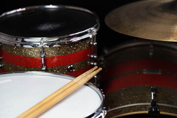 Obraz premium Closeup of drumsticks lying on the professional drum set. Drummer equipment. 