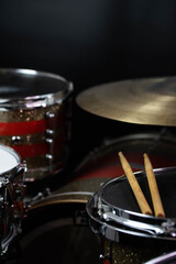 Fototapeta na wymiar Closeup of drumsticks lying on the professional drum set. Drummer equipment. 