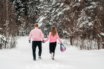 Fototapeta na wymiar Happy active couple in winter forest, moroz day, lifestyle.