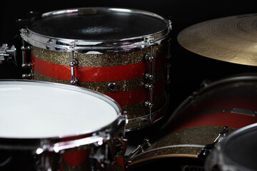 Obraz na płótnie Canvas Closeup of drumsticks lying on the professional drum set. Drummer equipment. 