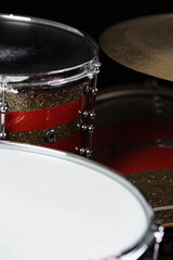 Closeup of drumsticks lying on the professional drum set. Drummer equipment. 