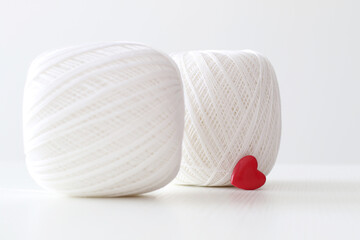 white crochet yarn with red hearts