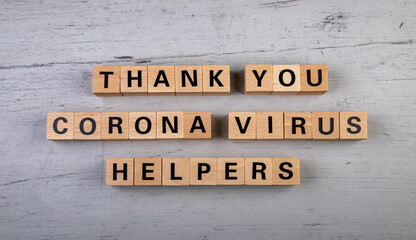 wooden blocks  in a white and grey board with the text thank you corona virus helpers