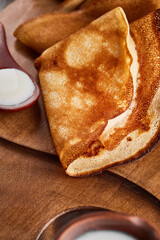 Thin pancakes stacked in a stack. Homemade pancakes, traditional for the Russian pancake week. Thin pancake with a crispy crust