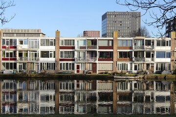 Amsterdam West Canal with Houses and Reflections in the Water