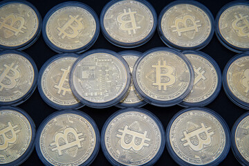 Stacked gold Bitcoin cryptocurrency (BTG). Coins on a dark background. Blockchain technology, Crypto currency, digital money.