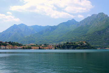 Fototapeta premium Lake Como in Italy. Lombardy. The azure water of the lake. In the background, the town of Lecco at the foot of the Alps 
