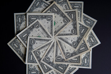 Pile of american dollars cash on black table. Bank image and photo background.