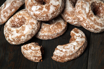 Homemade round gingerbread cookies with icing on a vintage table. Idea for a delicious breakfast or dinner. Top view