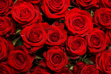 Beautiful bouquet of red roses, seen from above. Spring flowers. Wedding, women's day, mothers day and valentines day background. Selective shallow depth of field.