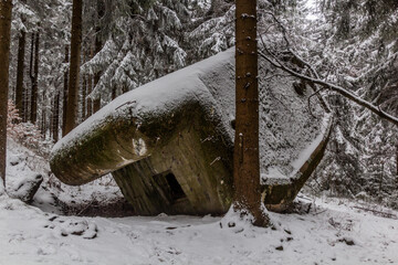 Winter view of damaged concrete pillbox from the WW2, Czech Republic