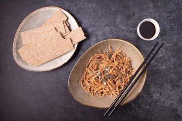 Buckwheat noodles. On a blue background. Horizontal orientation