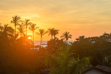 Boat crossing during sunset seen from afar