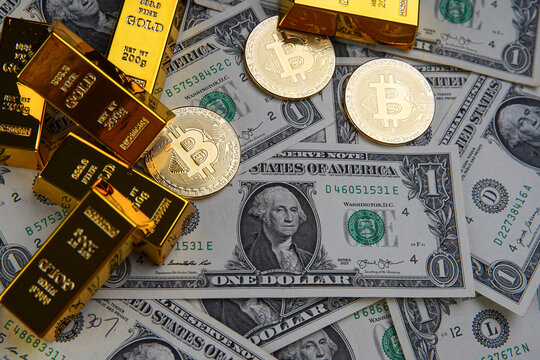 Gold bars and american one dollar bills. Scattered bitcoin digital cryptocurrency coin. Bank image and photo background.