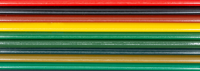 Colored pencils in different colors lined up in rows for banner background, school, art and webdesign in panoramic