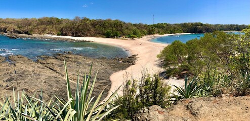 Panoramic view of two beaches during a sunny day