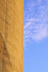 Part of concrete silo and blue sky