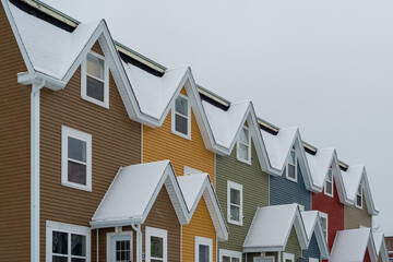 St. John's, Newfoundland, Canada - February 2021: Street View of multiple colourful row houses in...