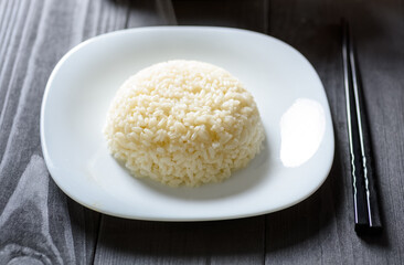 hot rice serving on a white plate