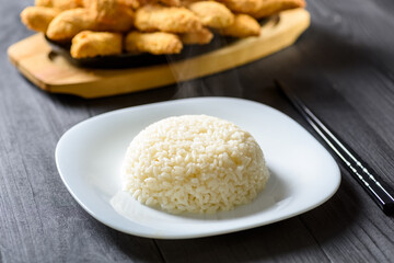 hot rice serving on a white plate