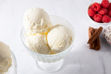 Vanilla Ice Cream Scoops with raspberries and chocolate sticks, easy dessert at home