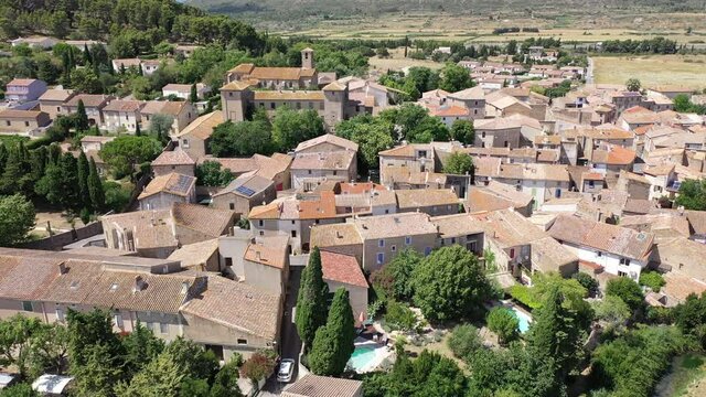 Scenic aerial view of French township of Fontcouverte at foot of Alaric mountain on sunny summer day, Aude, Occitanie