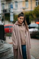 Cute sexy happy smiling brunette walking around the city