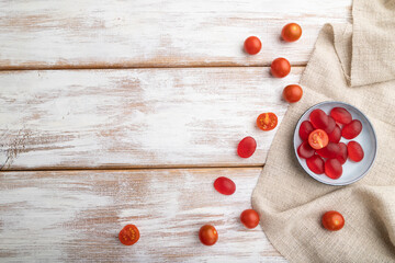 Fototapeta na wymiar Jelly tomato candies on white wooden background. copy space, top view.