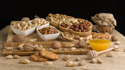 Different types of nuts, nuts in honey, nuts in slowmo, honey