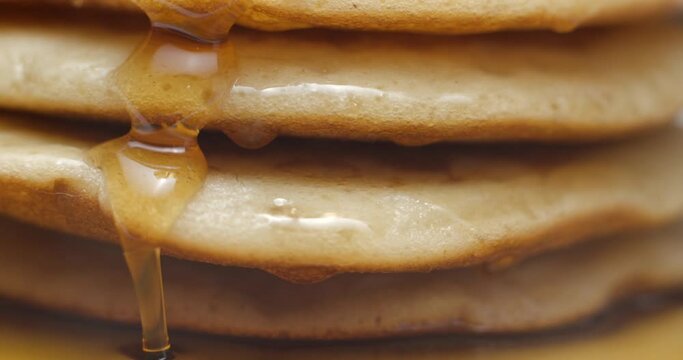 Pancakes and maple syrup macro slow motion 4K