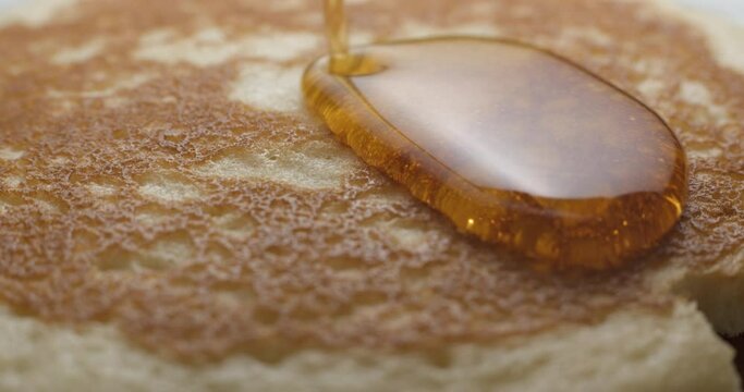 Pancakes and maple syrup macro slow motion 4K