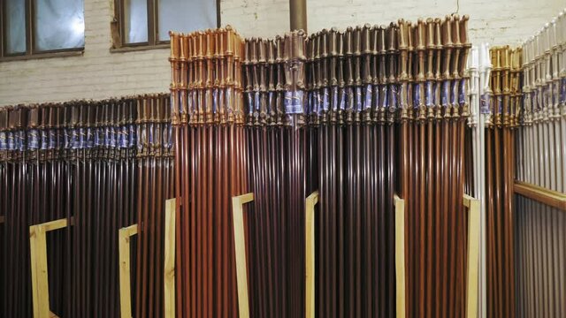 curtain rods. curtain rails. assortment of packed curtain rods in stock, ready for sale. manufacturing enterprise of curtain rods. accessories for curtains, window decoration