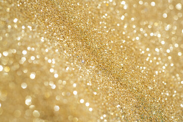 Sparkle Background. Golden giltter. Copyspace for celebration card.