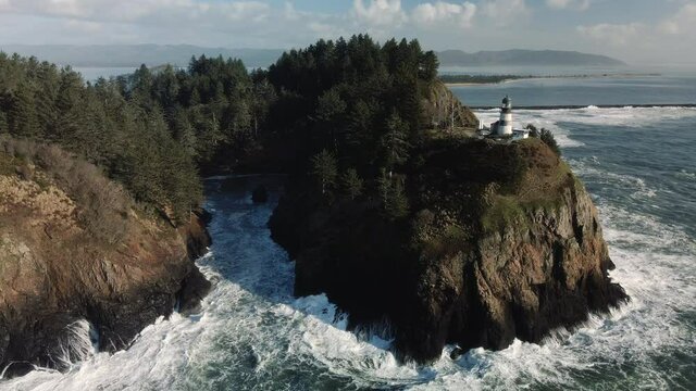 Waves Crashing on Dead Mans Cove and Cape Disappointment Lighthouse Aerial View