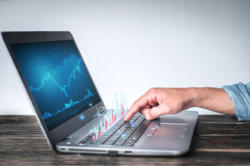 Obraz premium Businessman hand show Stock chart showing rising stock sign with graph indicator. Interest rate financial and mortgage rates concept. Double Exposure Image.