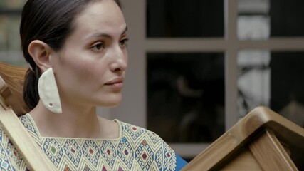 beautiful Girl dancing among chairs in garden at home with Andean typical dress, arty dancing art
